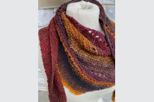 Boomerang shawl hand knit from hand spun wool, in reds, browns and golds